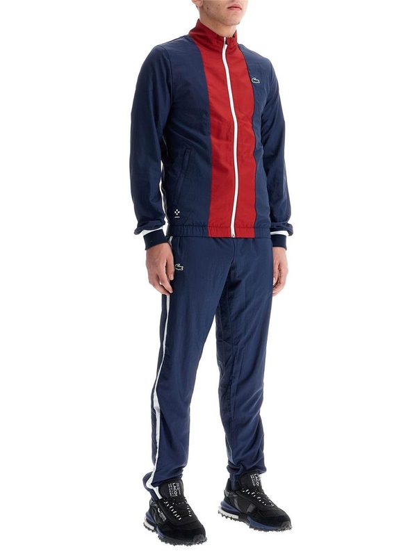 라코스테 FW24 in mesh\n\nsporty jumpsuit WH7581 EJ NAVY BLUE ORA WHITE